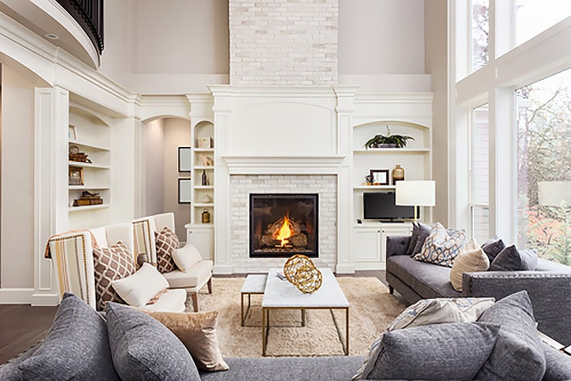 A Just Gas Log Fires Single-Sided Fireplace providing warmth to a home