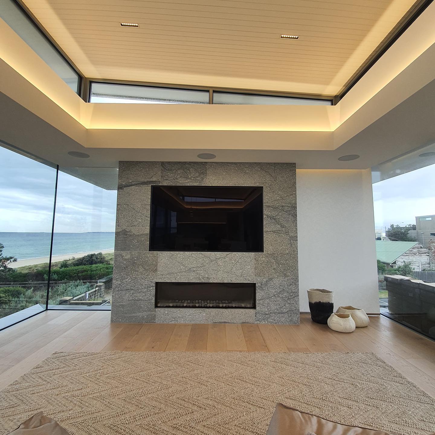 Gas log fireplace with beach view in the background